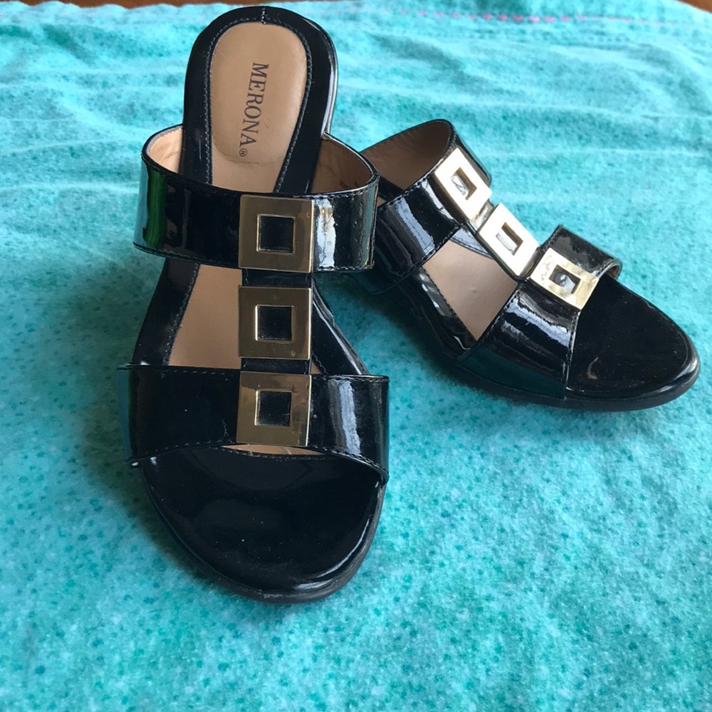 Black wedge sandals with gold accents
